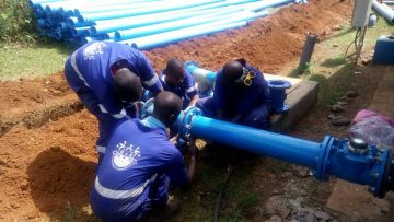 NWSC-engineers-installing-a-water-pipe
